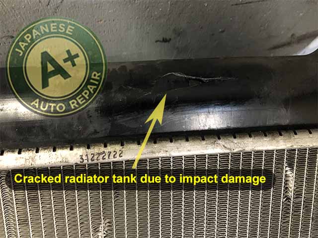 Image shows cracked radiator tank due to impact damage - A+ Japanese Auto Repair Inc. San Carlos, CA